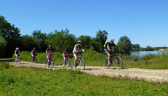 A Group of people cycling in the Cotswold Water Park