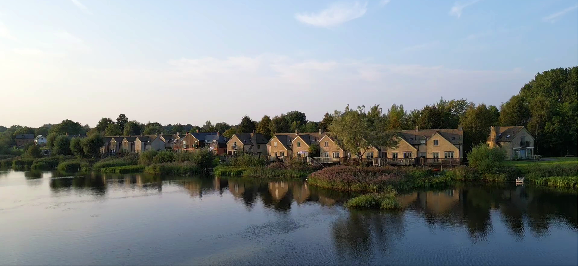 View of lakeside properties at Mill Village in the Cotswold Lakes.
