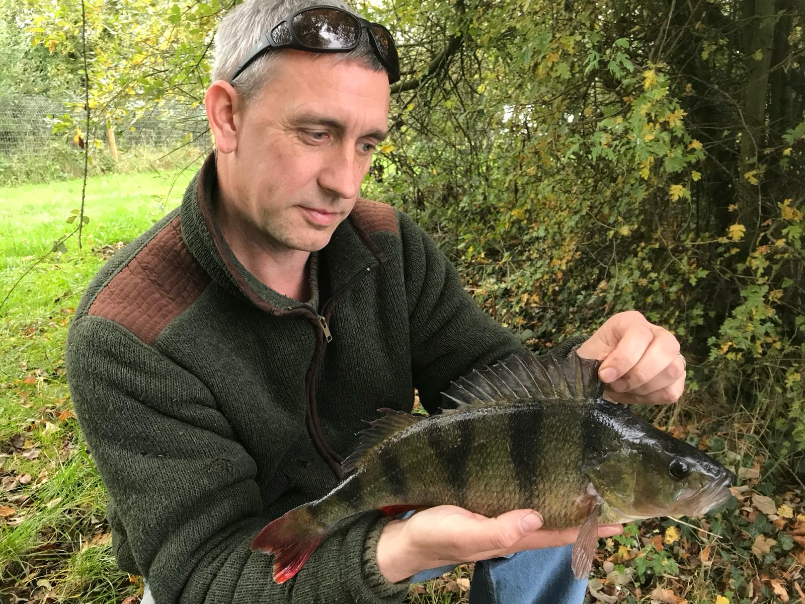 Fisherman on holiday showing off his catch of the day