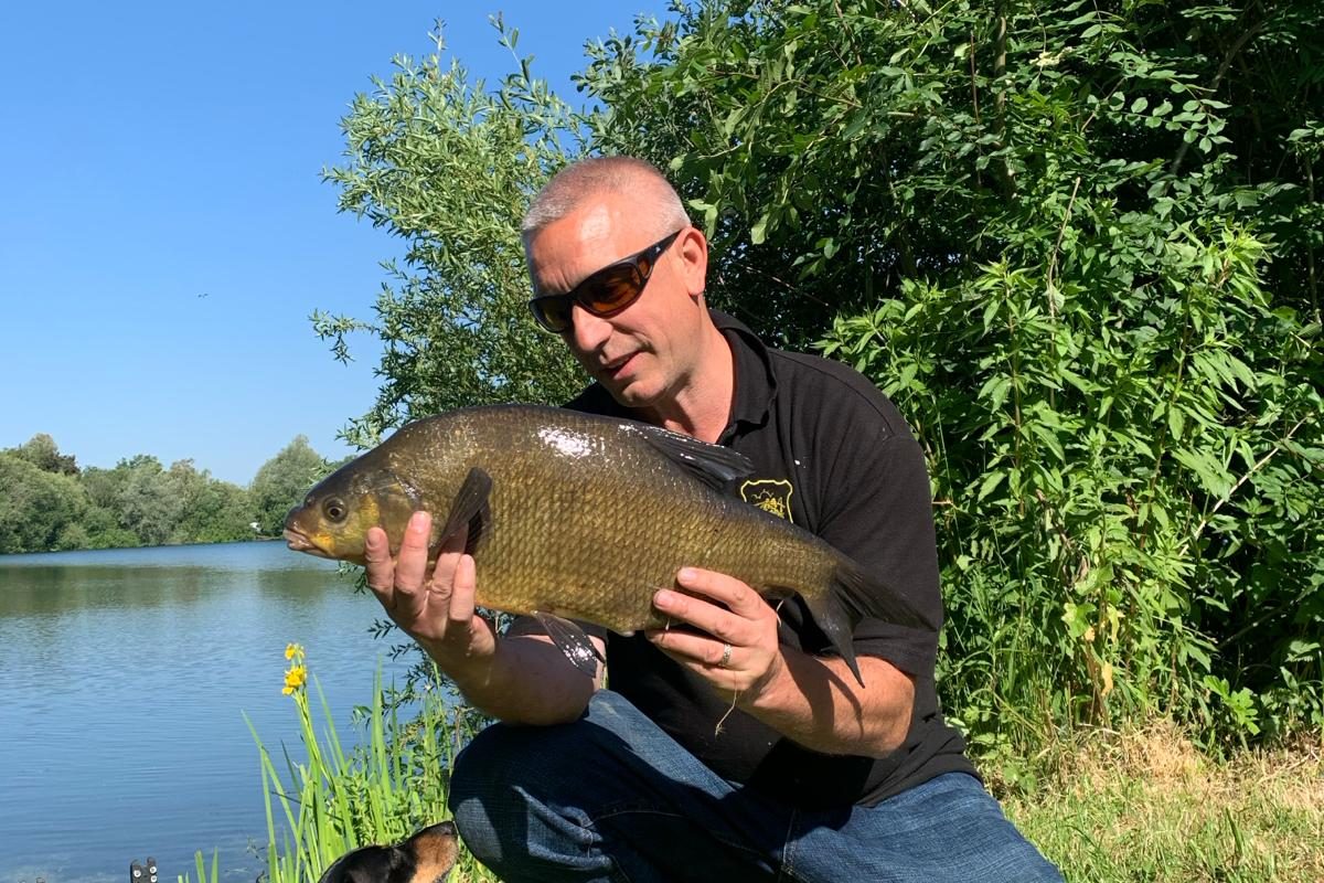 Proud fisherman showing off his catch